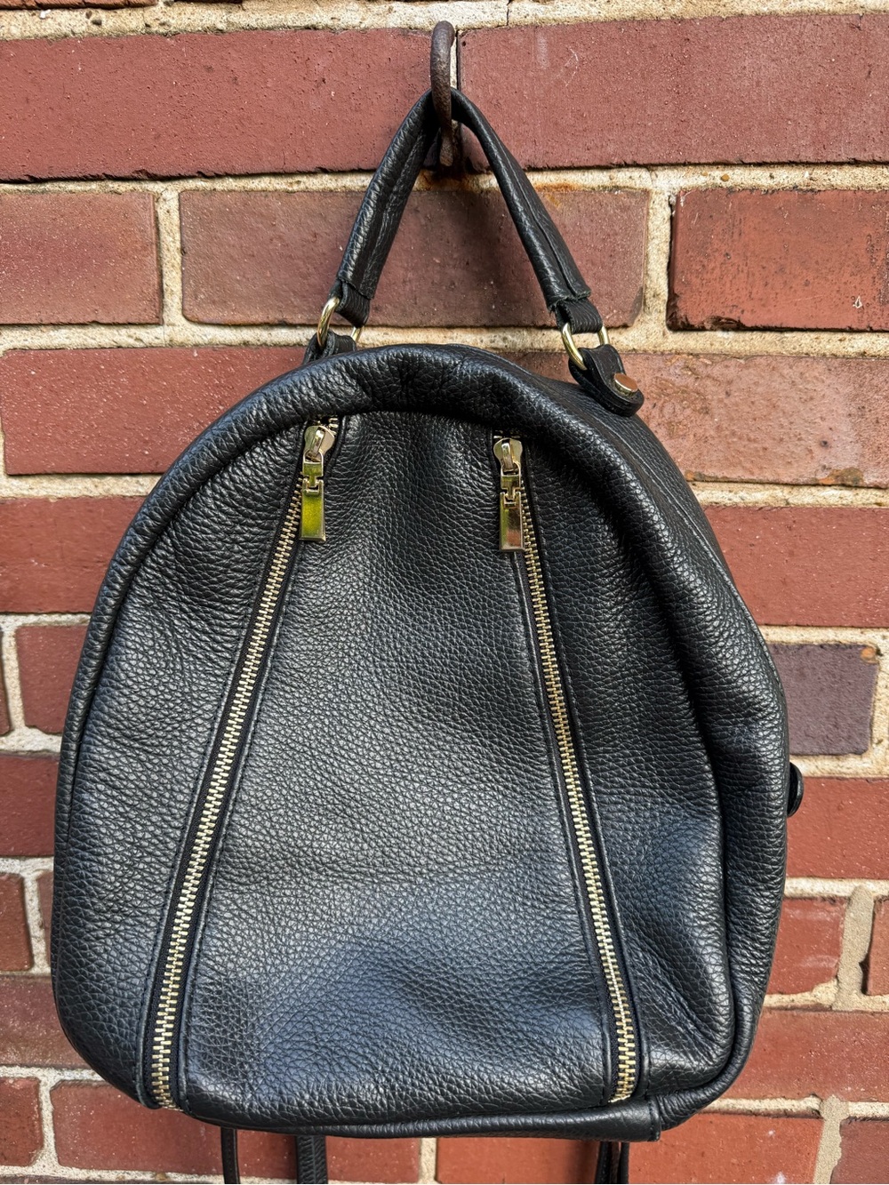 Black Pebbled Leather Backpack with Gold Zippers